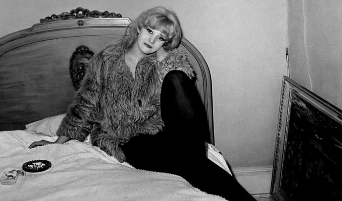 Untitled diane arbus girl in coat on bed nyc